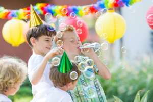 Boys wearing birthday hats